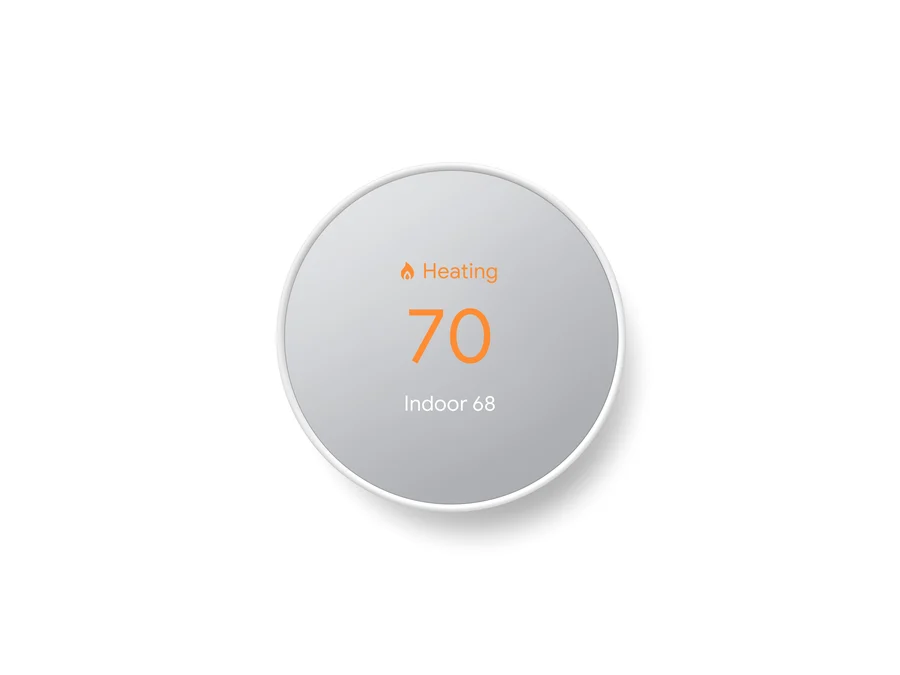 A Google Nest Thermostat (2020) in a white finish, its round front reading Heating with a target of 70 and Indoor 68.
