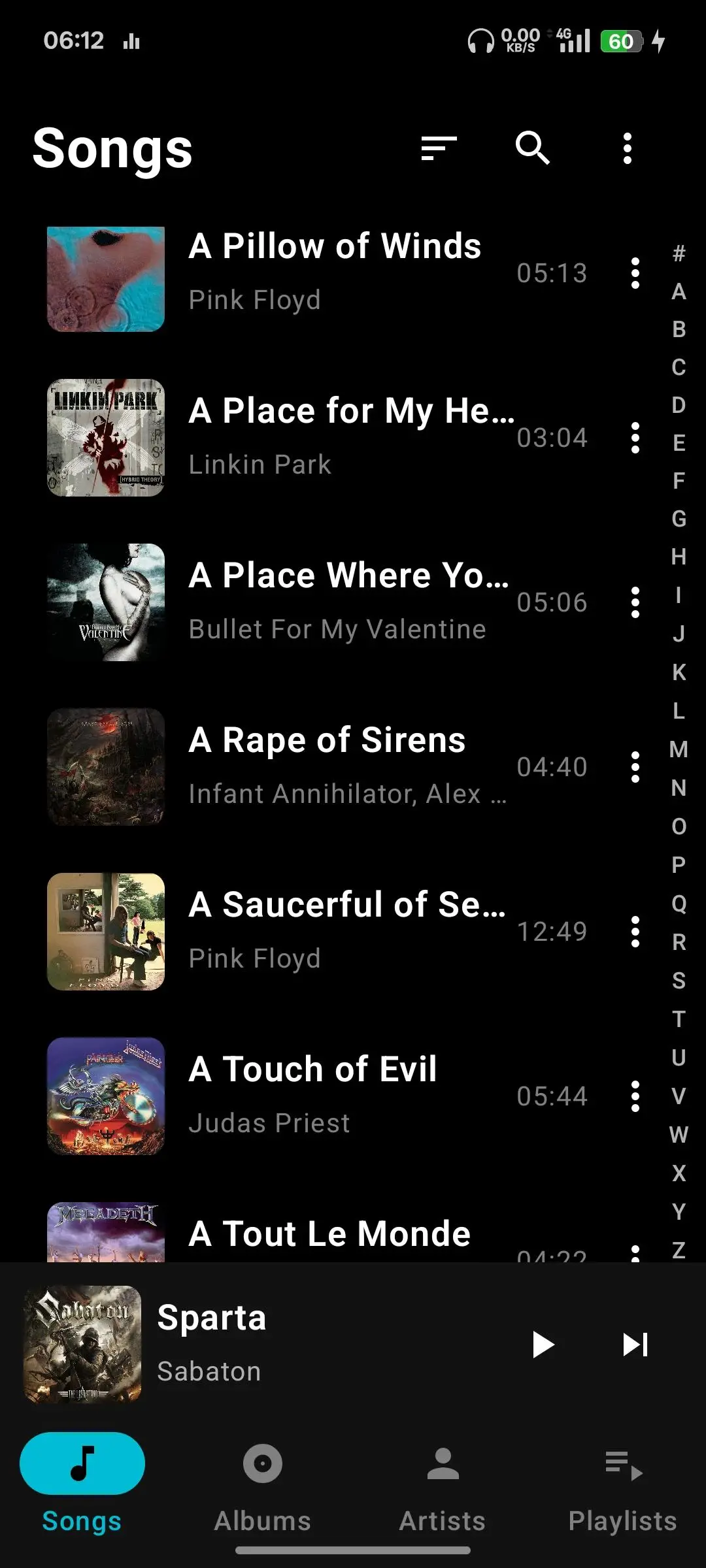 Local Player song list on a dark theme with a mini player at the bottom