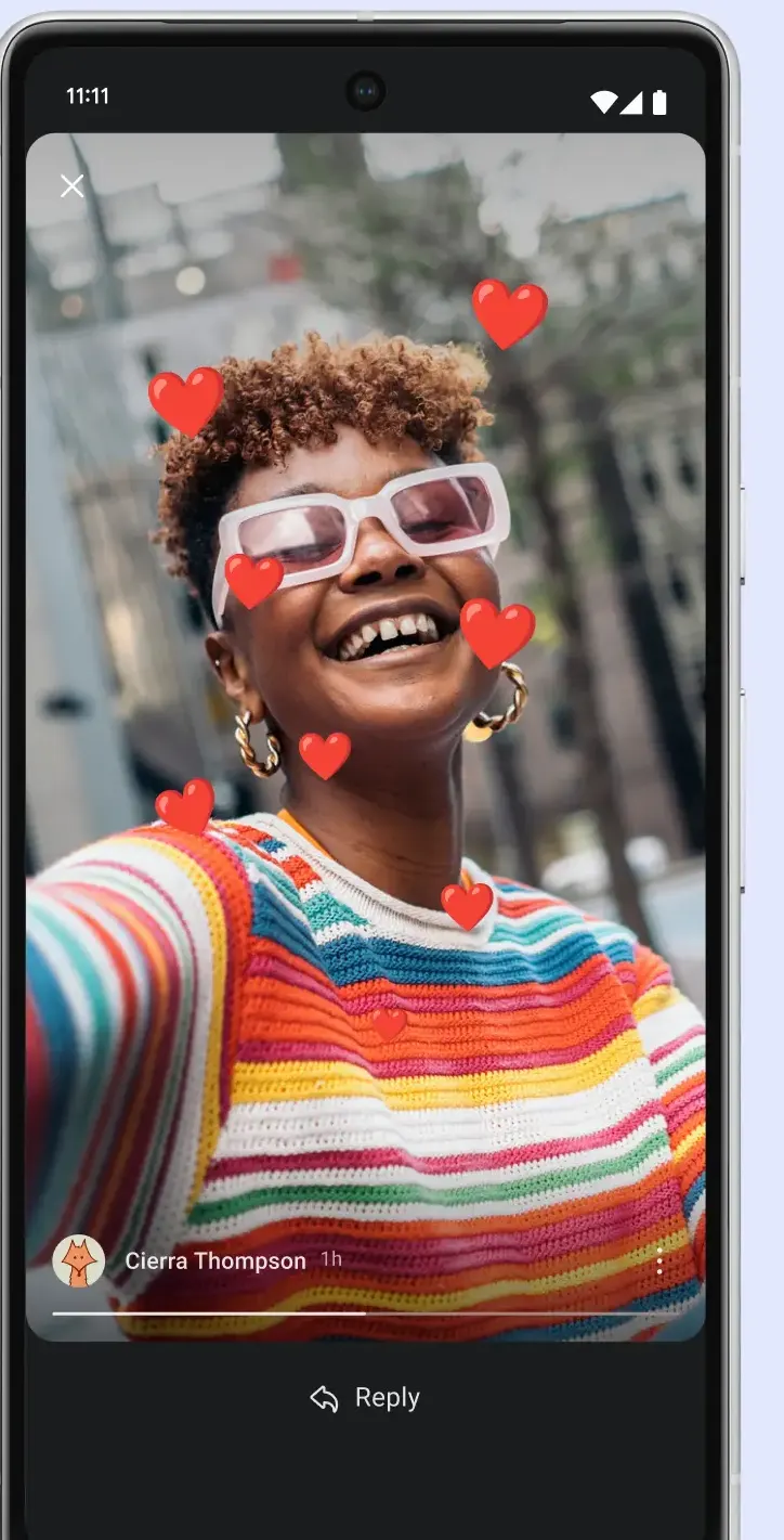 Story viewer showing a full-screen photo with floating heart reactions, the poster name, a progress bar and a Reply button.