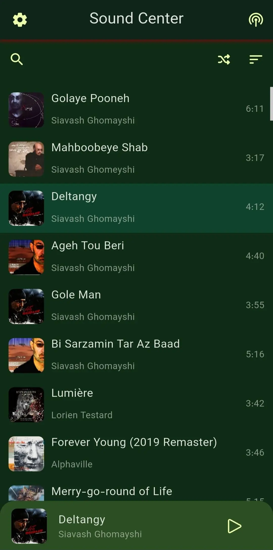 Sound Center track list on a dark green theme