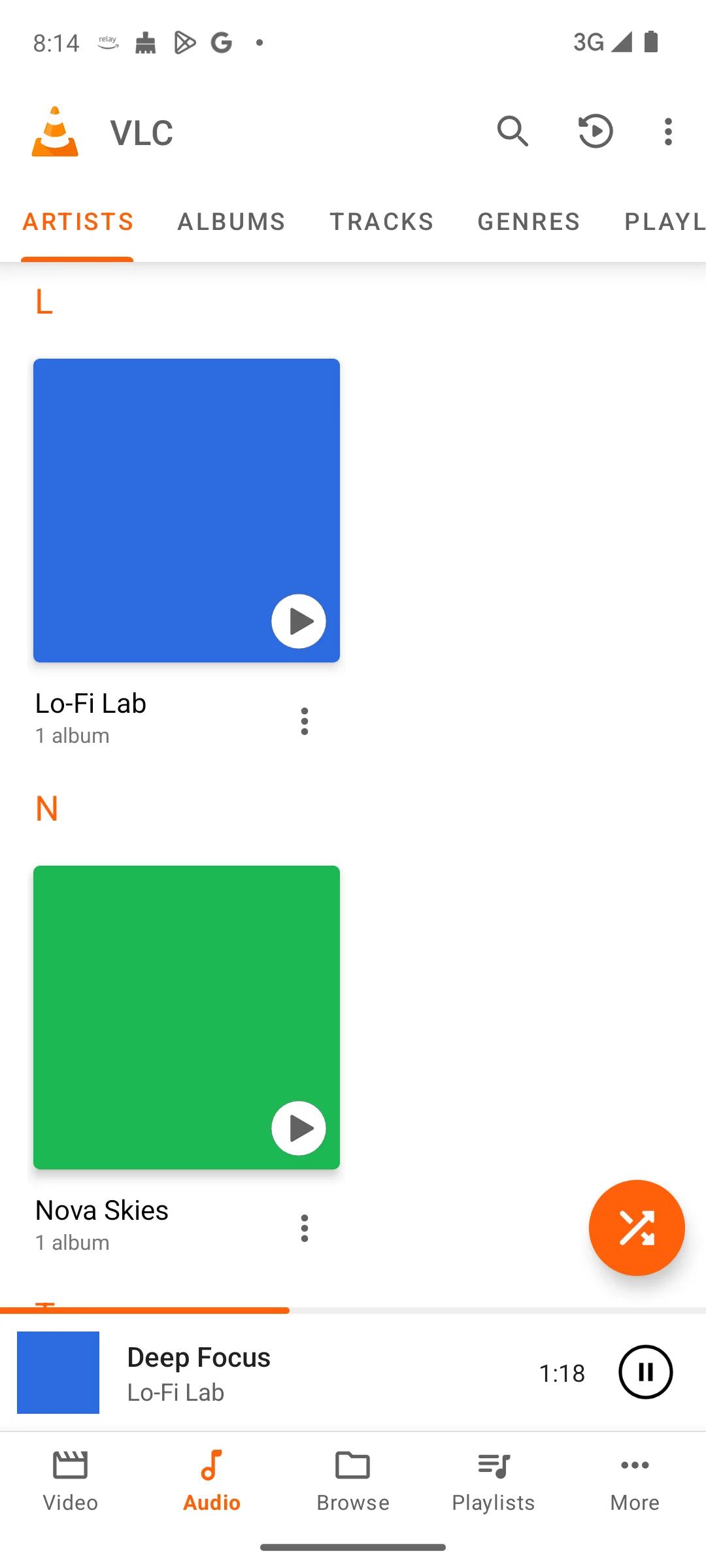 VLC artists view with a now-playing bar